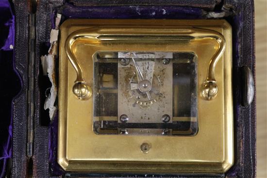 A cased carriage clock and two small lantern clocks